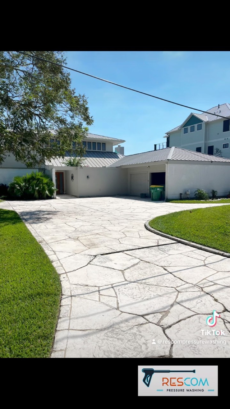 Freshly cleaned driveway by ResCom Pressure Washing